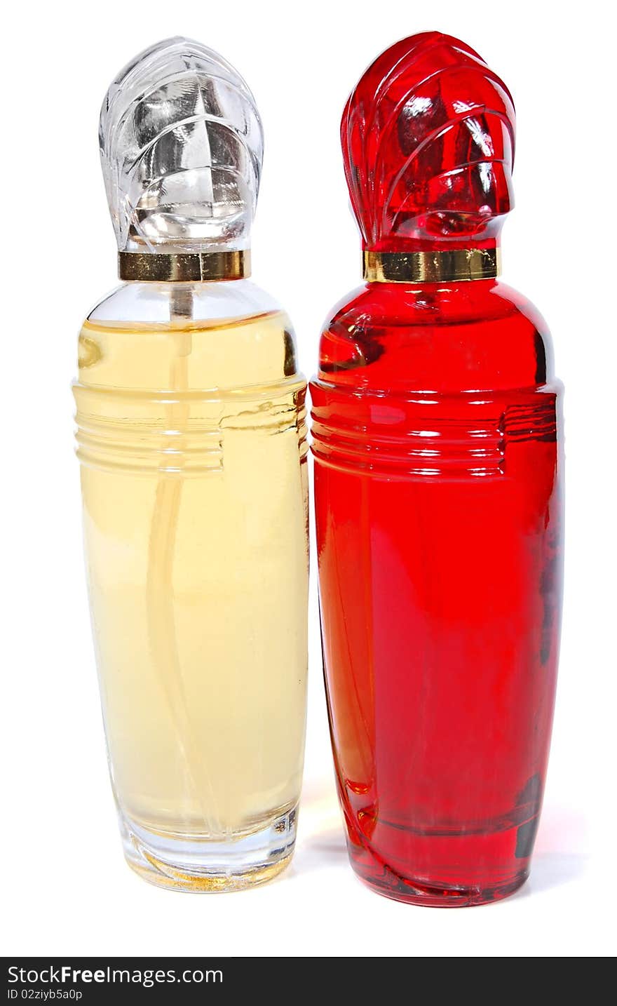 Three bottles of perfume on a white background.