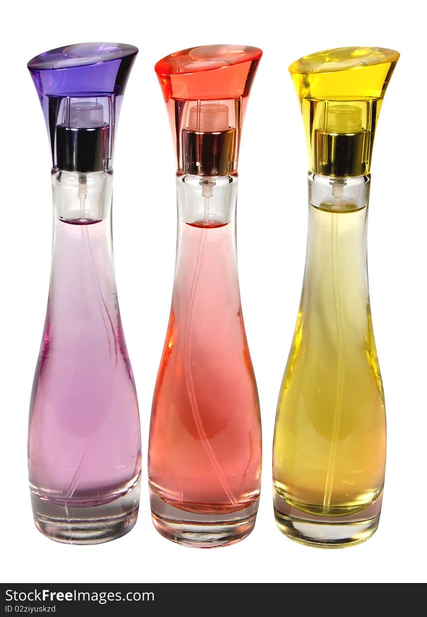 Three glass bottles of perfume isolated on a white background