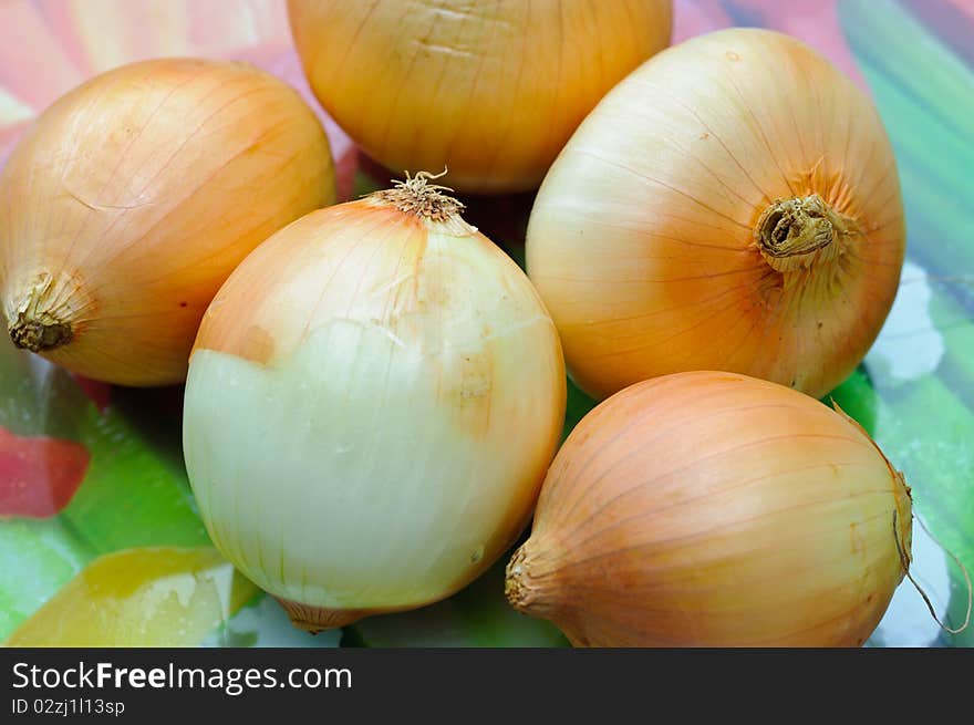 Fresh vegetables on a cut table. Onions