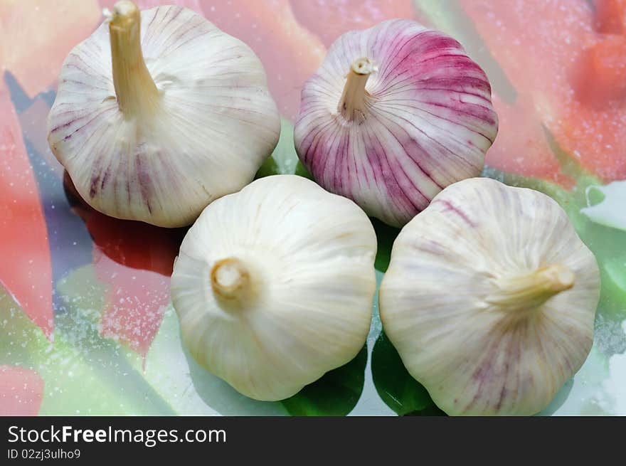 Fresh vegetables on a cut table. Garlic