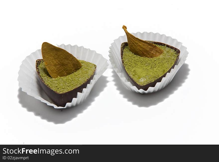 Two green candies on white background. Two green candies on white background