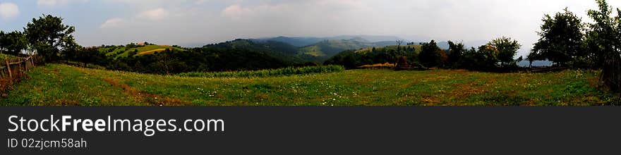 A panoramic image taken from the top of a mountain