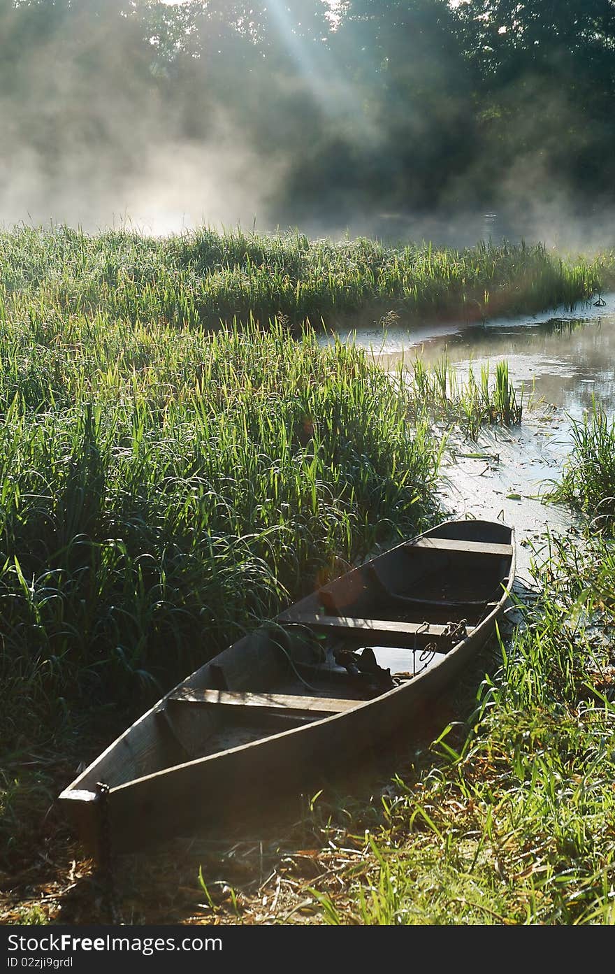 Beautiful river and old rowing boat in green grass. Beautiful river and old rowing boat in green grass