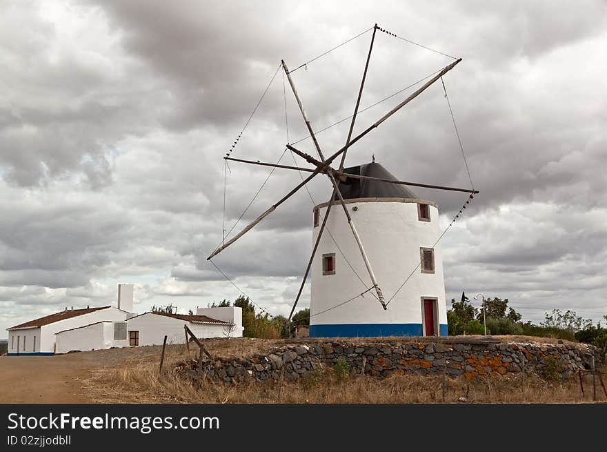 Photo of beautiful wind mill in Portugal.