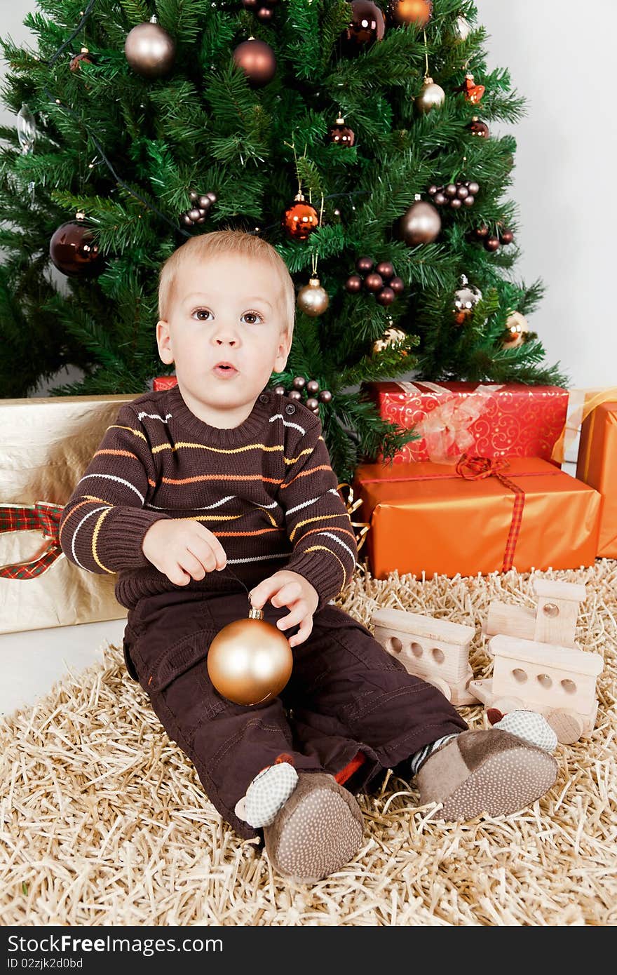 Baby boy waiting santa klaus at christmas at home