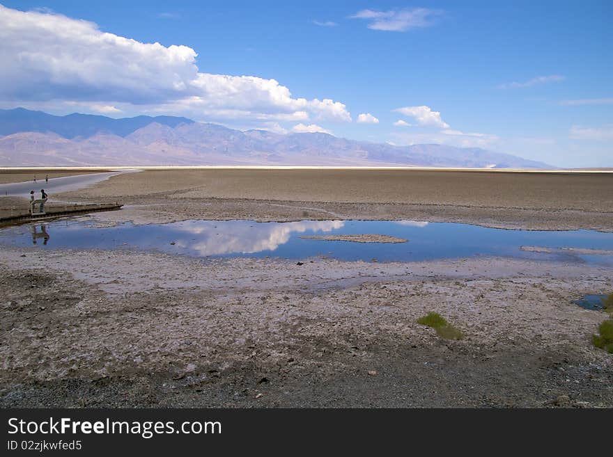 Tourists walking in Badwater Basin, Death Valley National Park. Tourists walking in Badwater Basin, Death Valley National Park