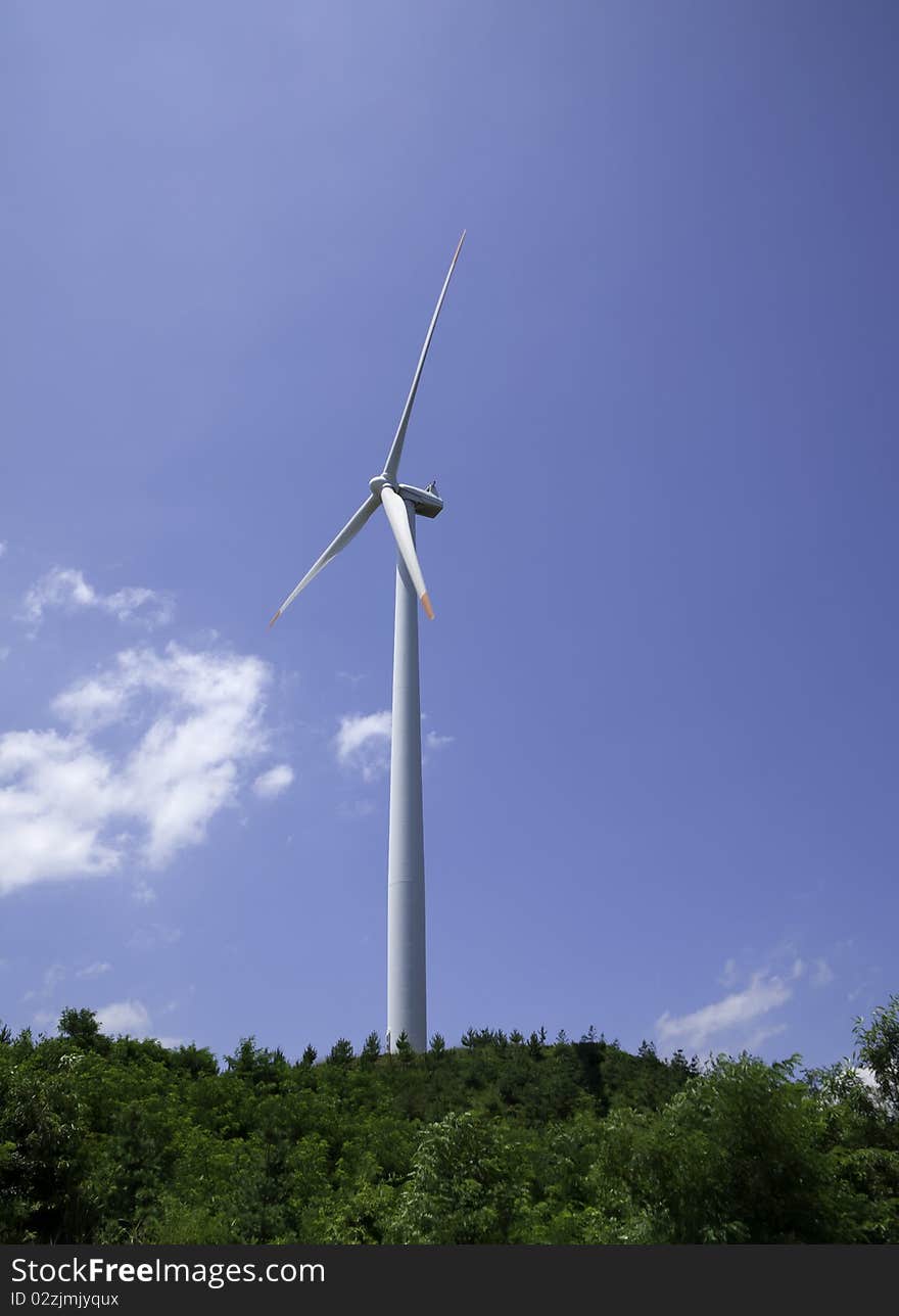 Power generating windmills is running on the hill