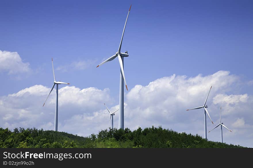 Power generating windmills is running on the hill