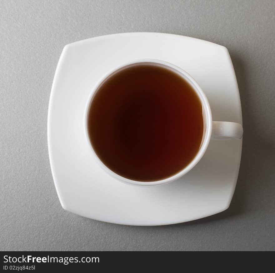 White cup of tea over kitchen table