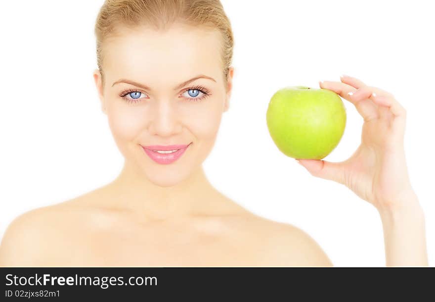 Attractive girl holding a green apple isolated on a white background