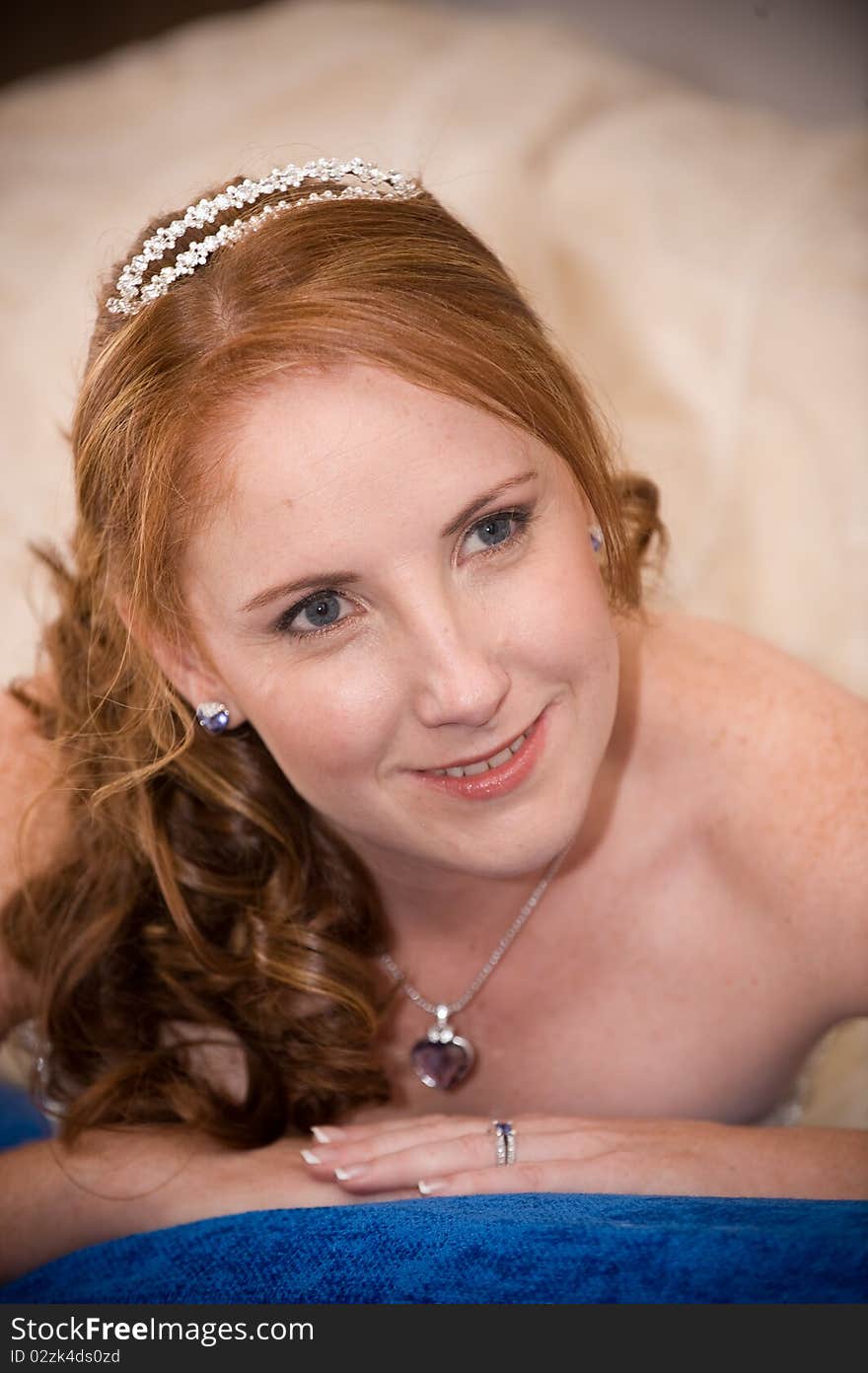 Just married bride laying down with cleavage