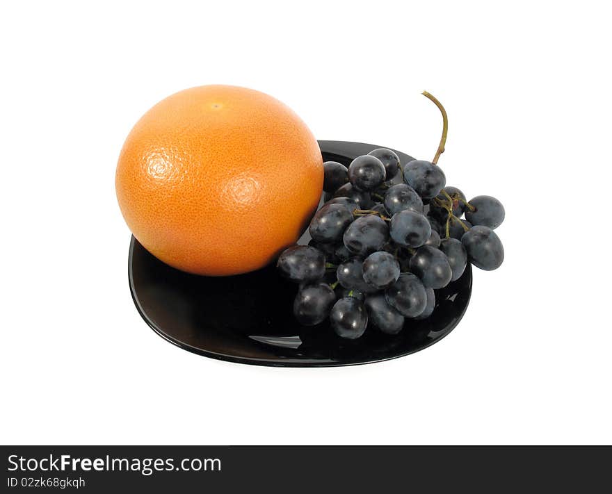 Set of fruits on a dish. Isolated on white. . Set of fruits on a dish. Isolated on white.