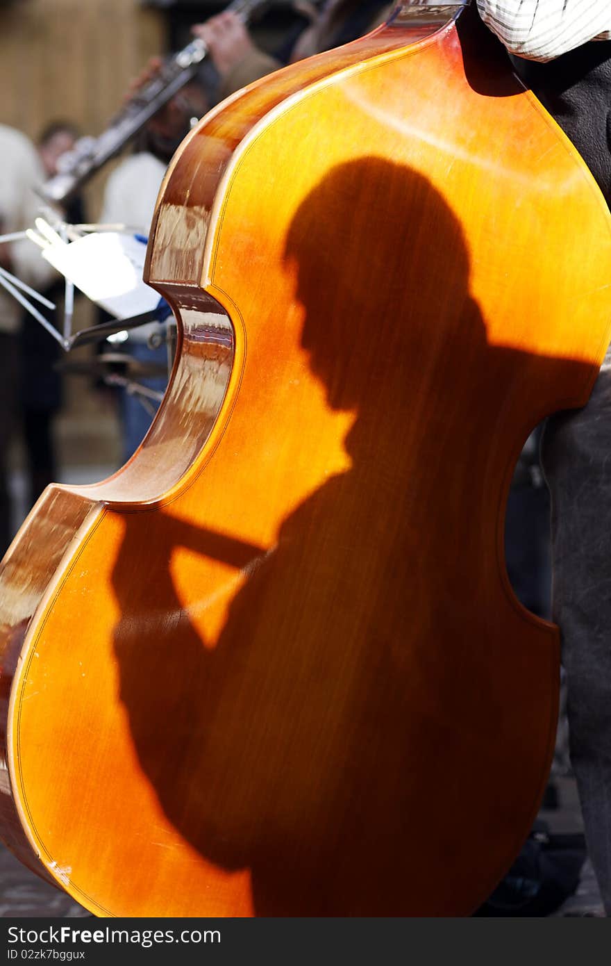 Cello in a street music group on summer