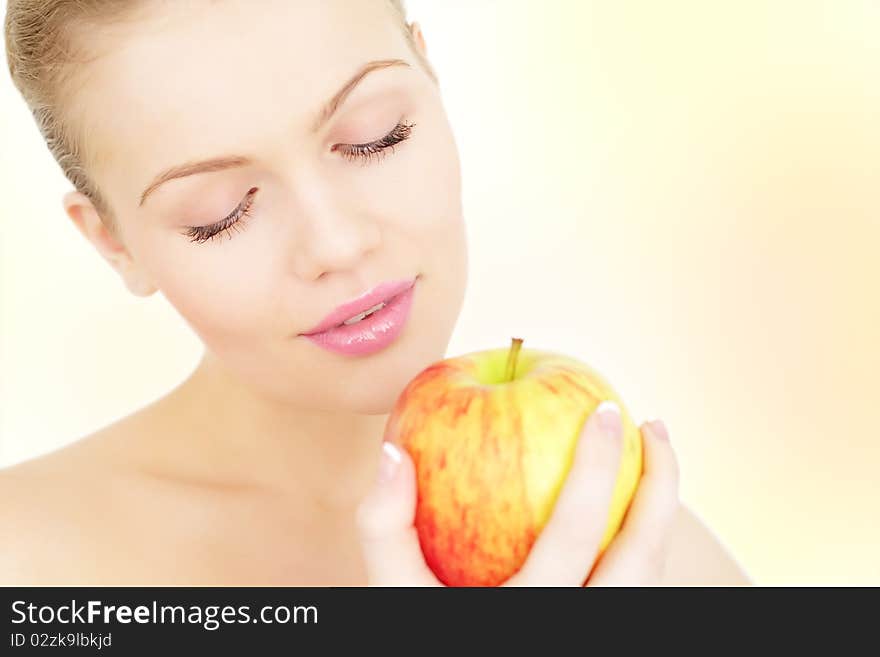 Pretty girl holding red apple