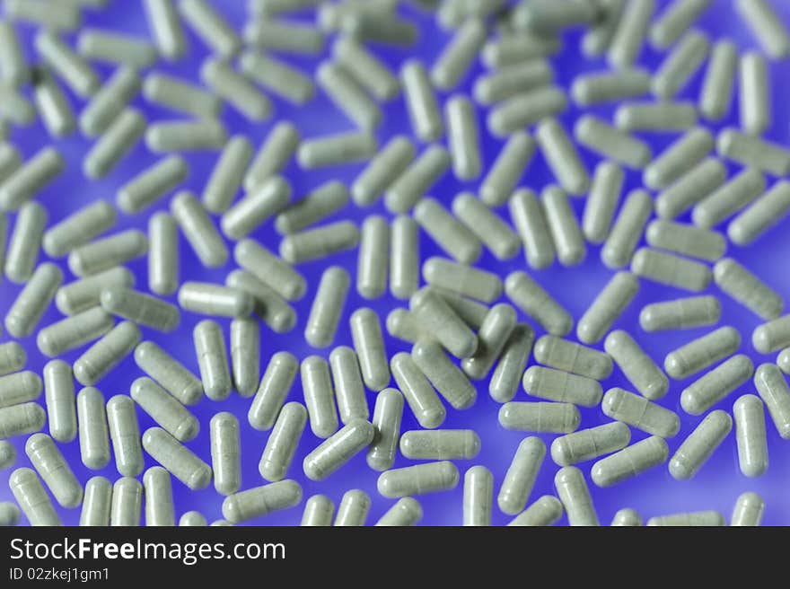 Pills on blue background