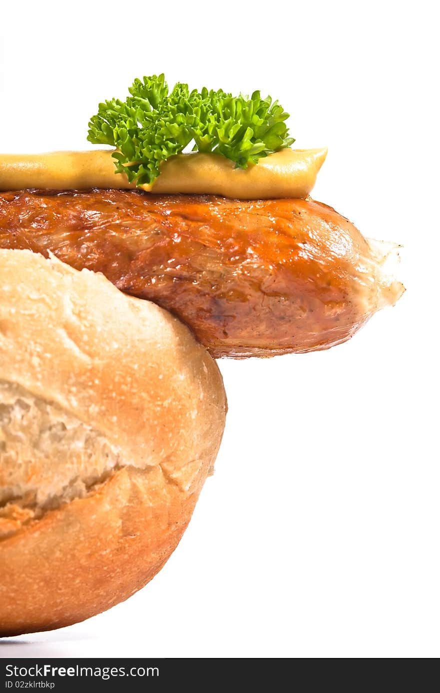 Sausage in a bun on a white background. Sausage in a bun on a white background