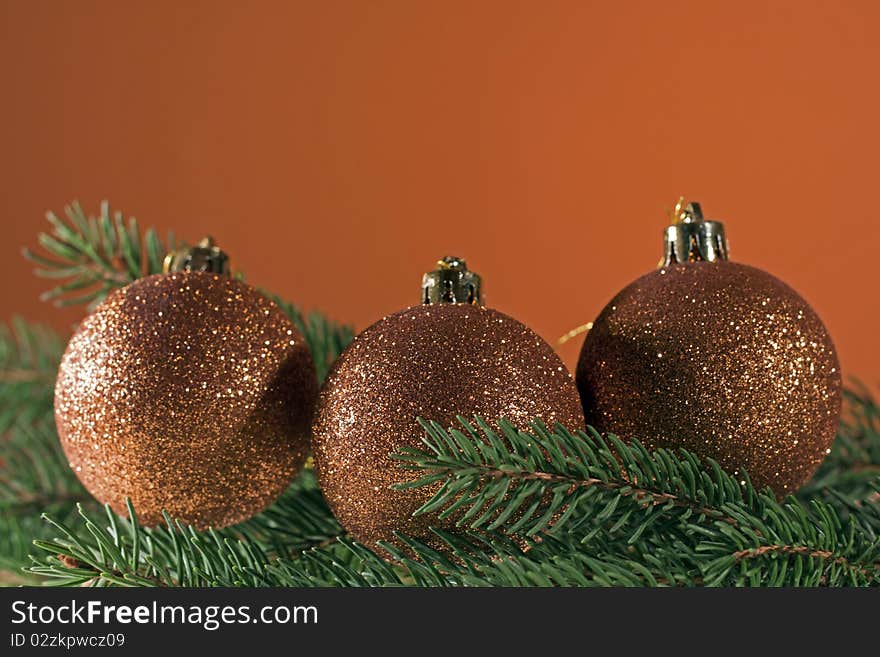 Christmas decoration, bronze christmas balls on spruce branch