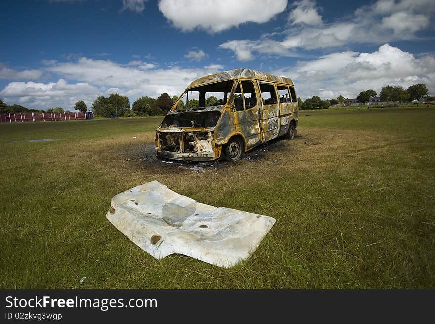 A stolen van, found burnt out on a playing field.