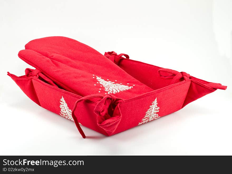 Red oven glove and bread basket