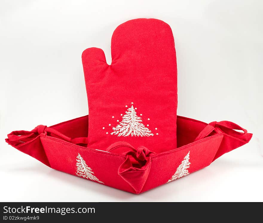 Red oven glove and bread basket