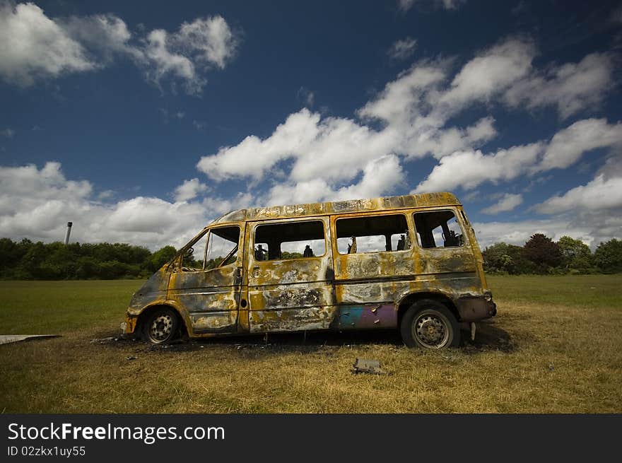 A stolen van, found burnt out on a playing field street. Taken early morning & with a polariser filter.