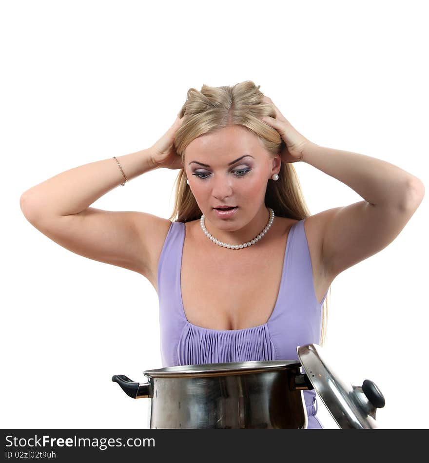 Young blond woman look to the pan and fill surprised. Young blond woman look to the pan and fill surprised