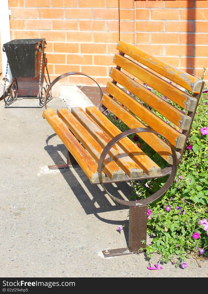 Wooden Park Bench In The Garden