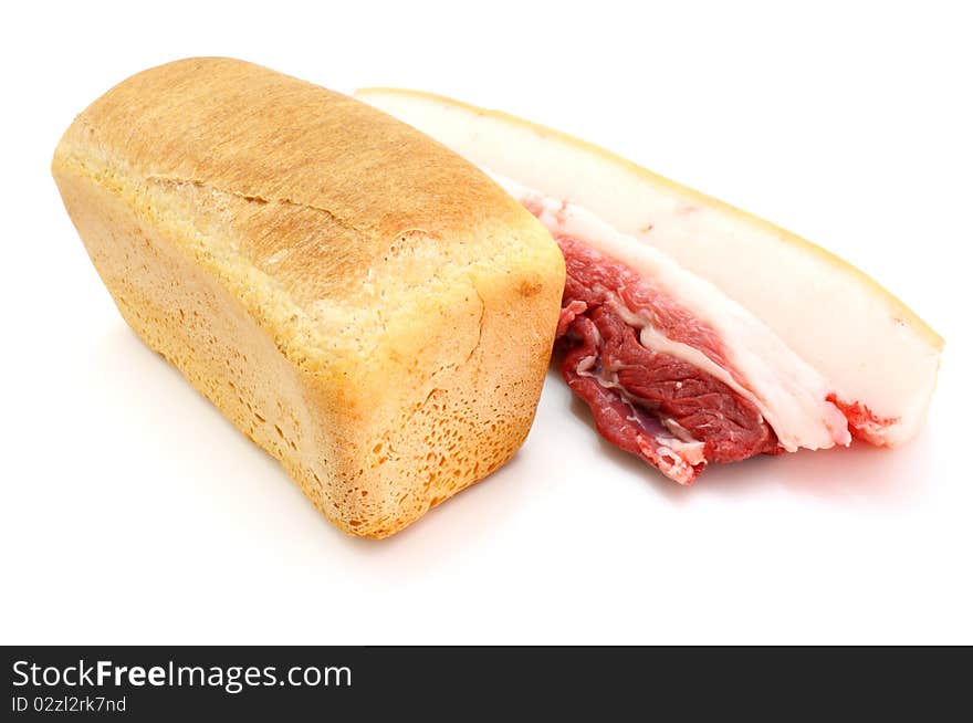 Roll of fresh bread and the big piece