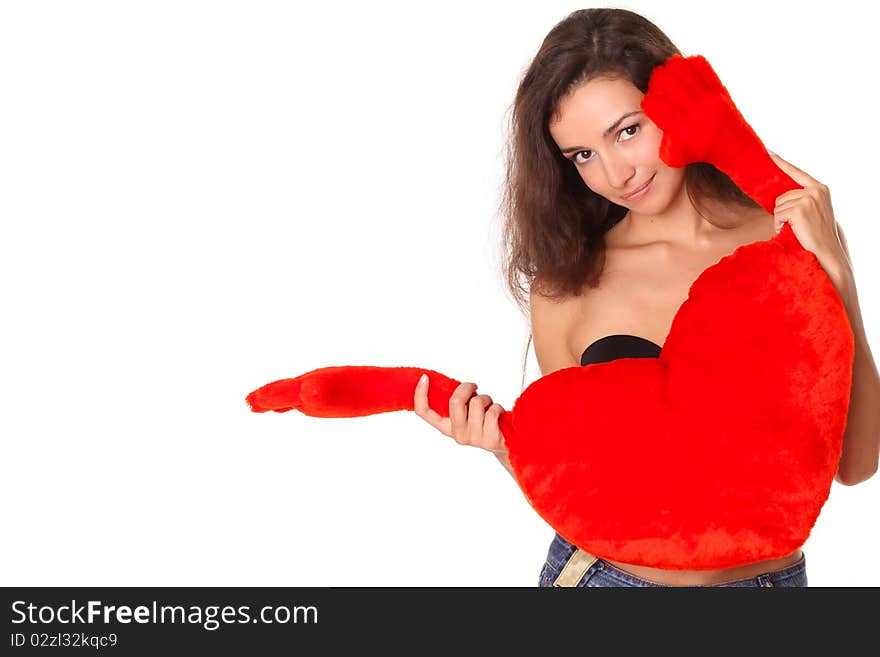 Smiling woman with red heart shows somewhere - isolated on white background