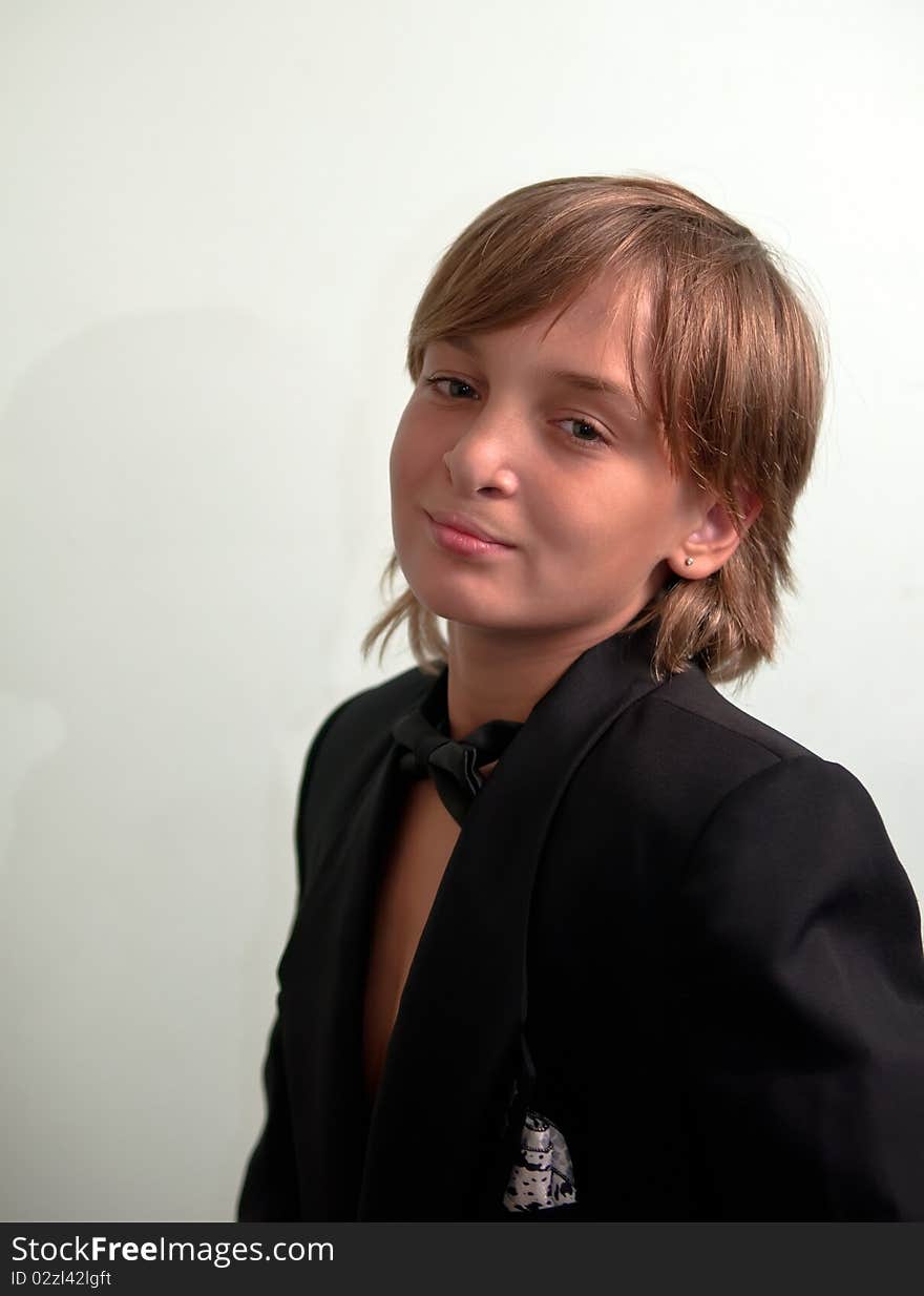 Boy wearing suit .