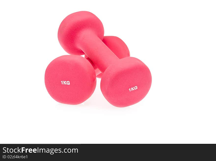 Two pink dumbbells isolated on white background