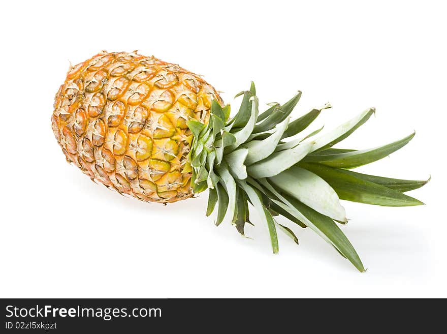 Fresh pineapple fruits with green leaf isolated on white background