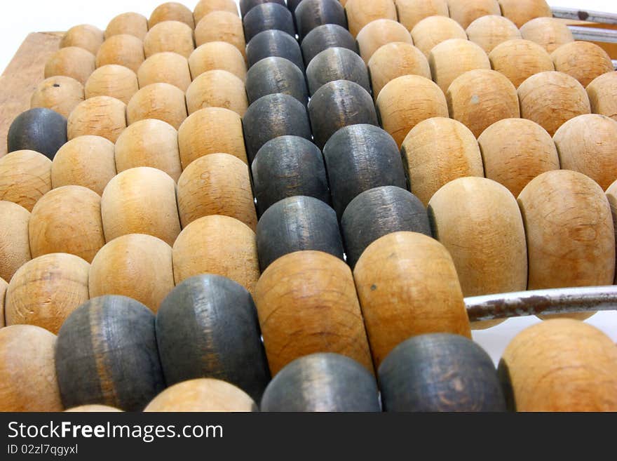 Accounting abacus for financial calculations lies on a white background. Accounting abacus for financial calculations lies on a white background