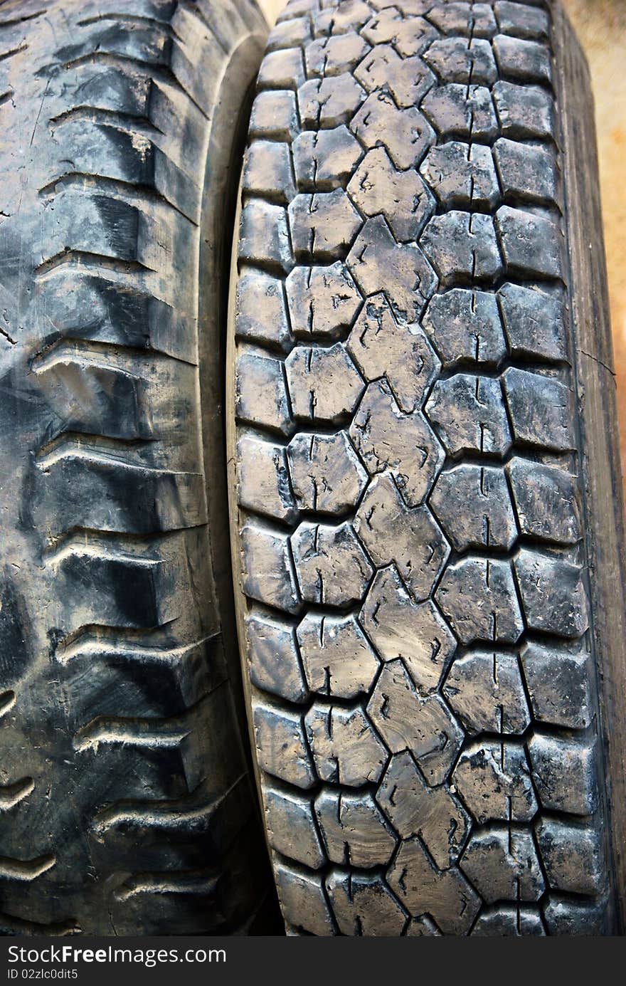 Old black tire in a salvage station. Old black tire in a salvage station