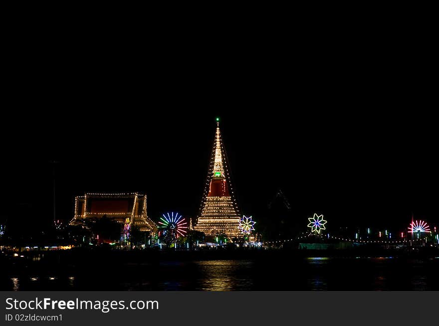 The temple Phra Samut Chedi in Samut Prakan, Thailand, decorated during a temple festival. The light reflected in the Chao Praya River. The temple Phra Samut Chedi in Samut Prakan, Thailand, decorated during a temple festival. The light reflected in the Chao Praya River.