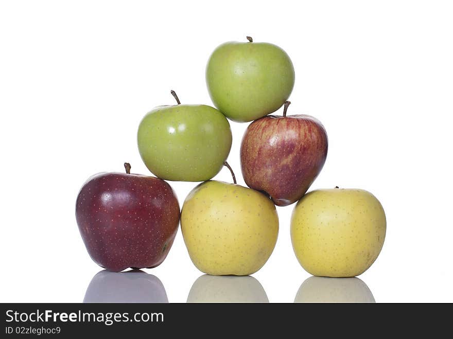 Red, yellow and green apples arranged in a pyramid. Red, yellow and green apples arranged in a pyramid.