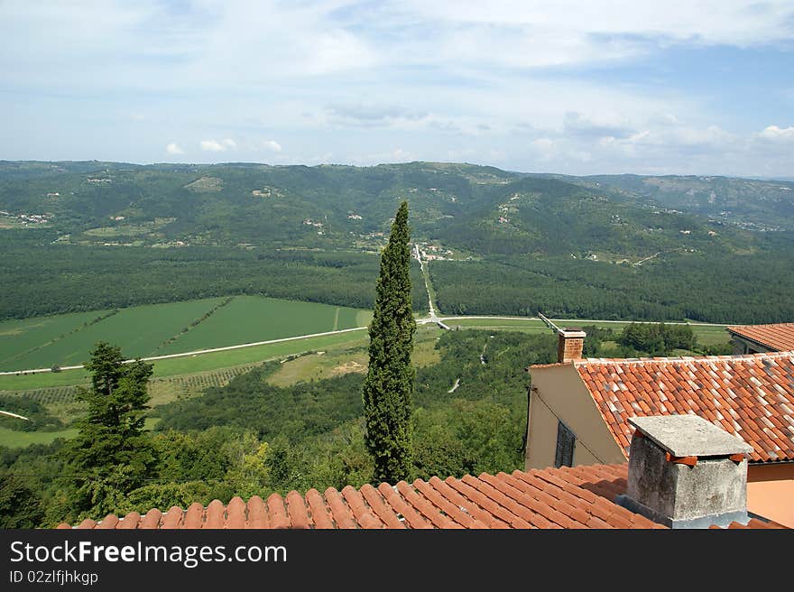 View of the house with red roofs and the valley