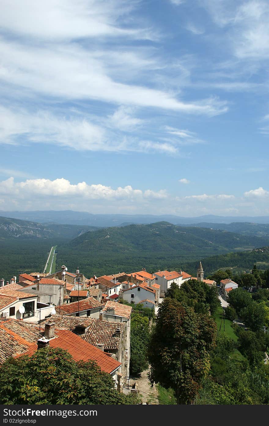 View of the house with red roofs and the valley