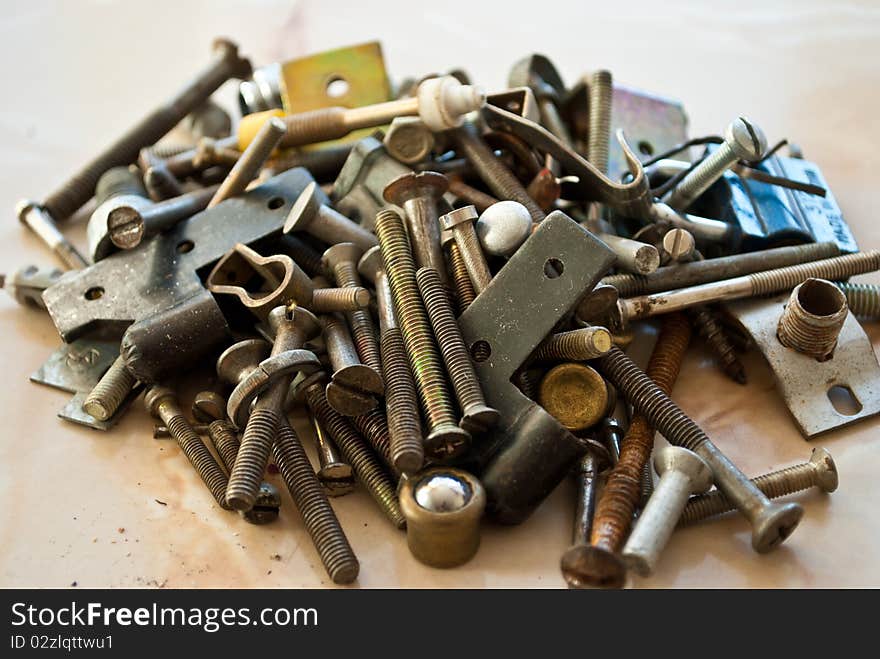 Pile of old, rusty screws and other metal parts. Pile of old, rusty screws and other metal parts