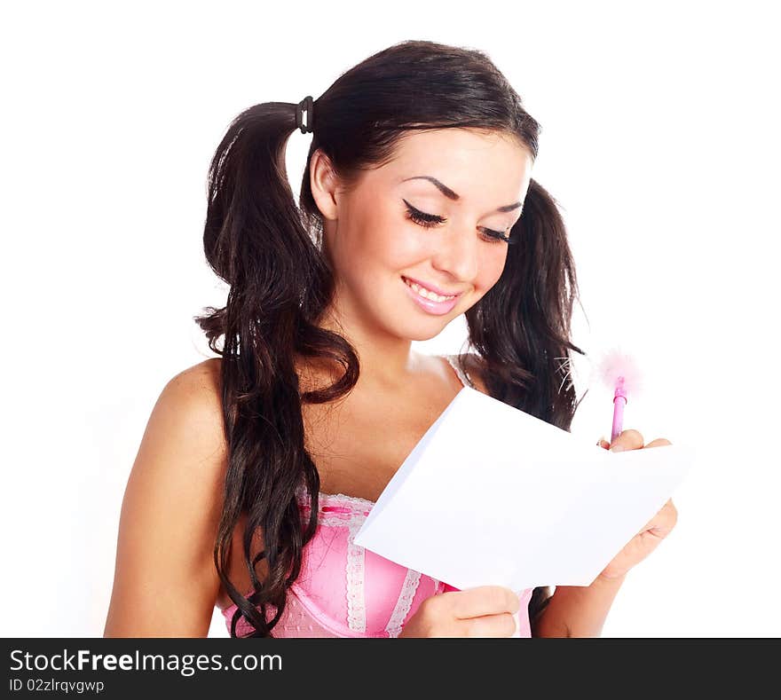 Portrait of a pretty brunette girl writing something. Portrait of a pretty brunette girl writing something