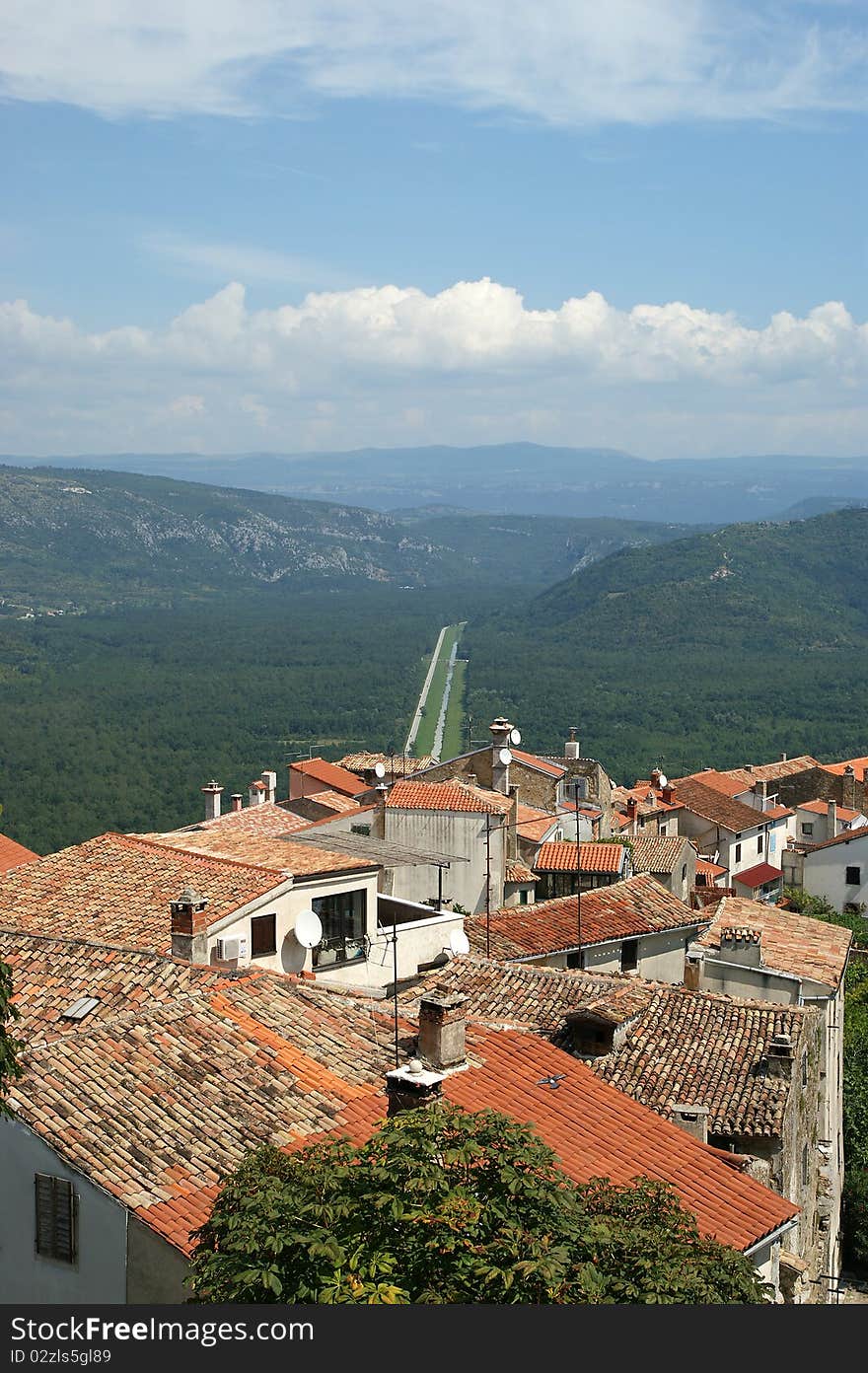 View of the house with red roofs and the valley