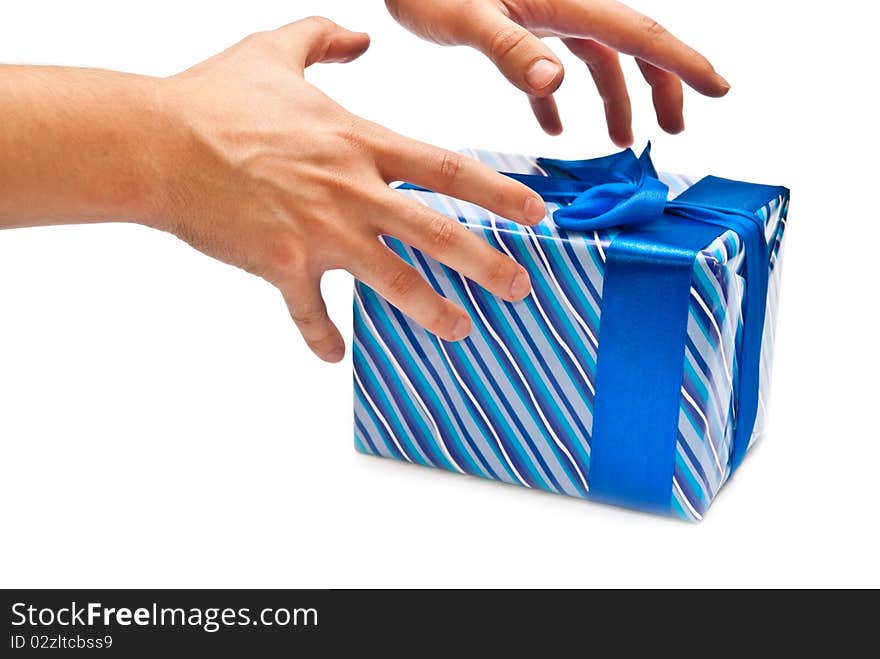 Blue gift box with bow and man's hands. Isolated on white. Blue gift box with bow and man's hands. Isolated on white