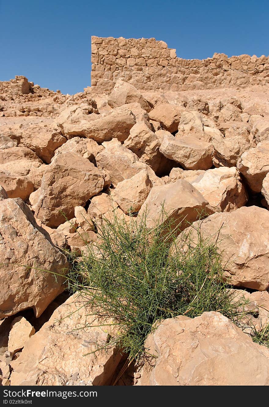 Ruins of ancient tower on the rocky hill in Masada fortress in Israel