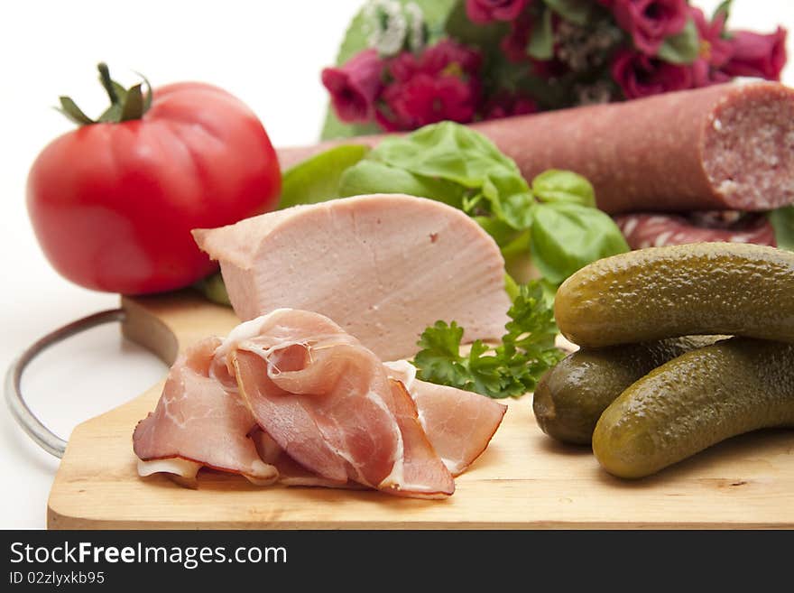 Raw ham with gherkins