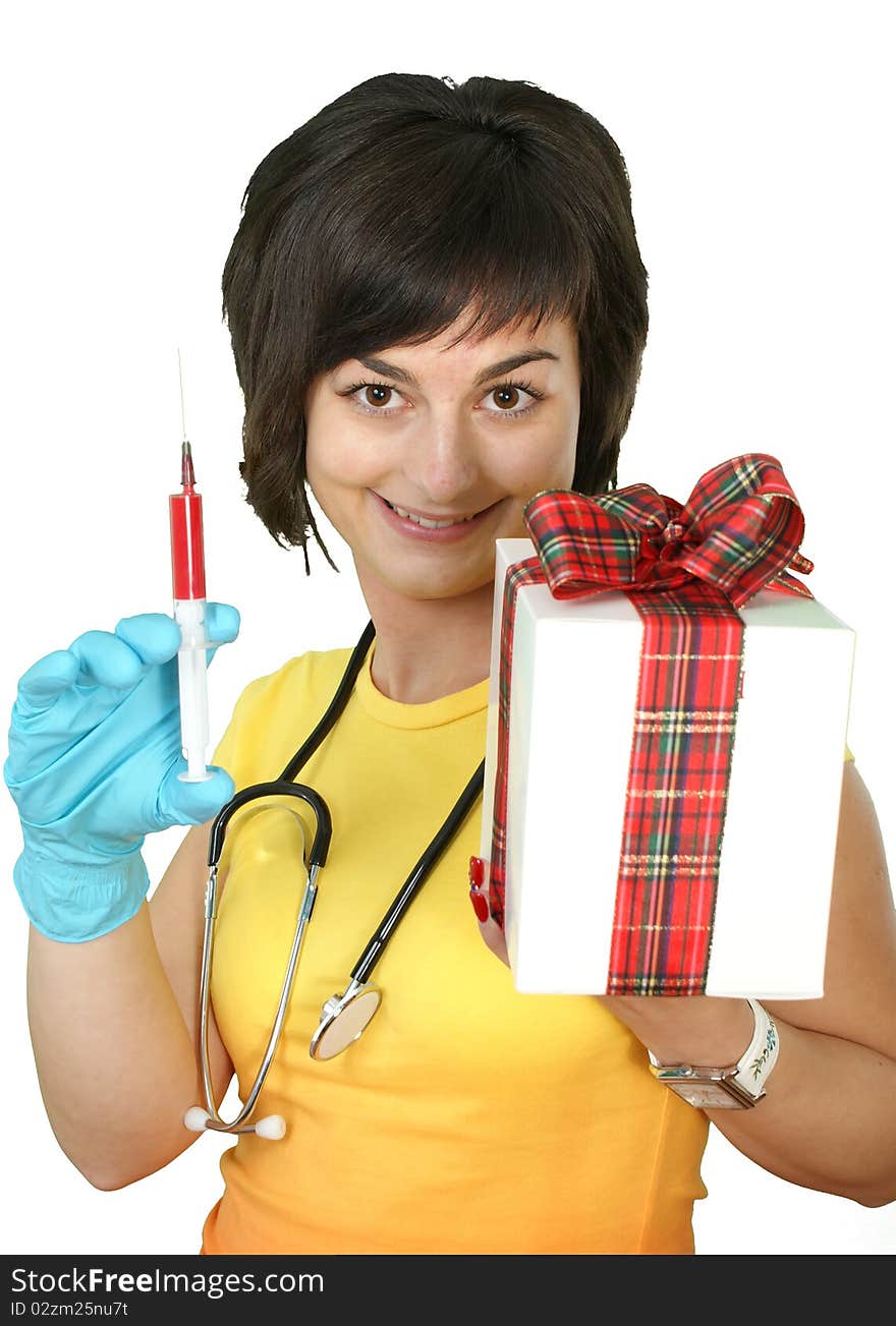 Medical doctor with syringe and gift box on white background