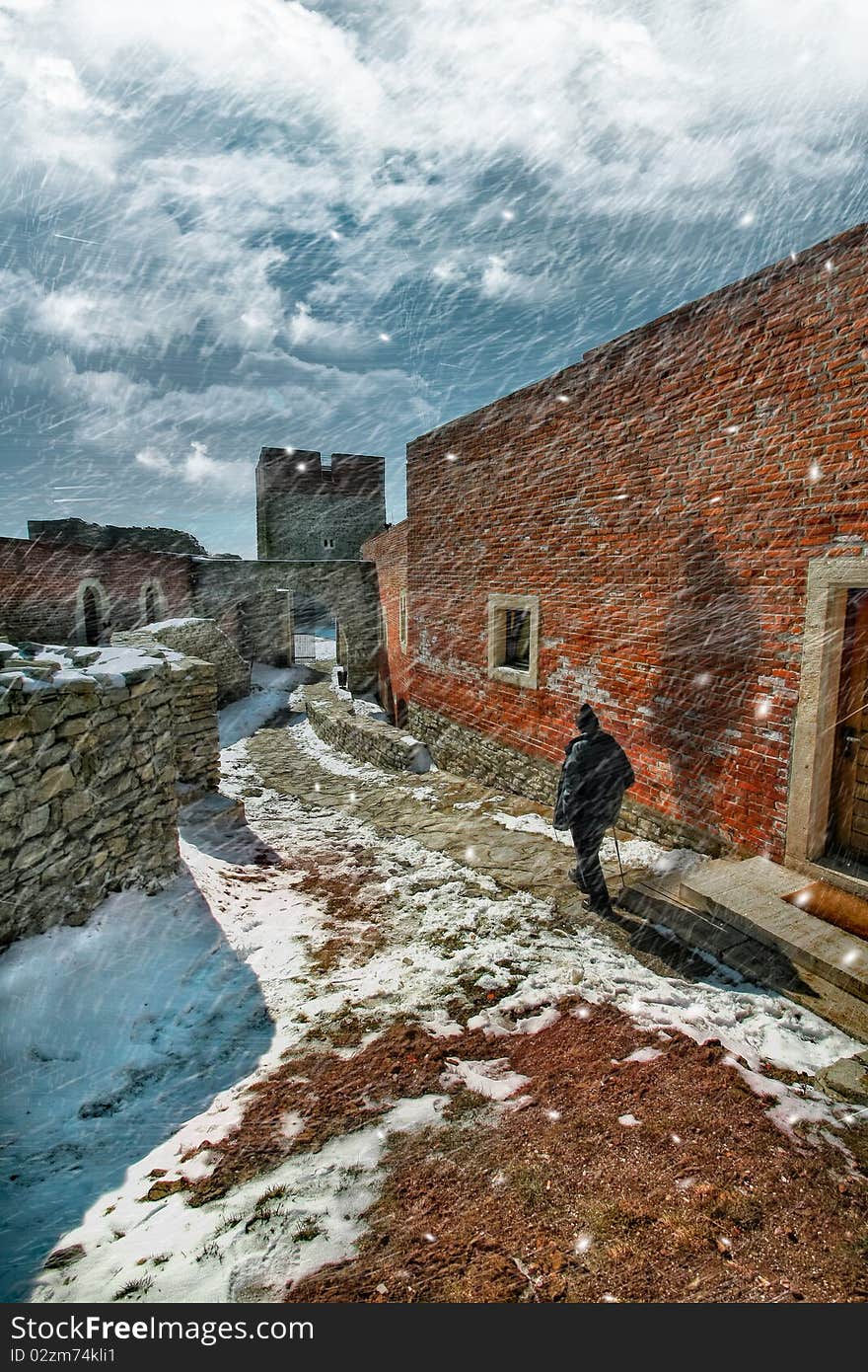 Man walking in a snow storm.