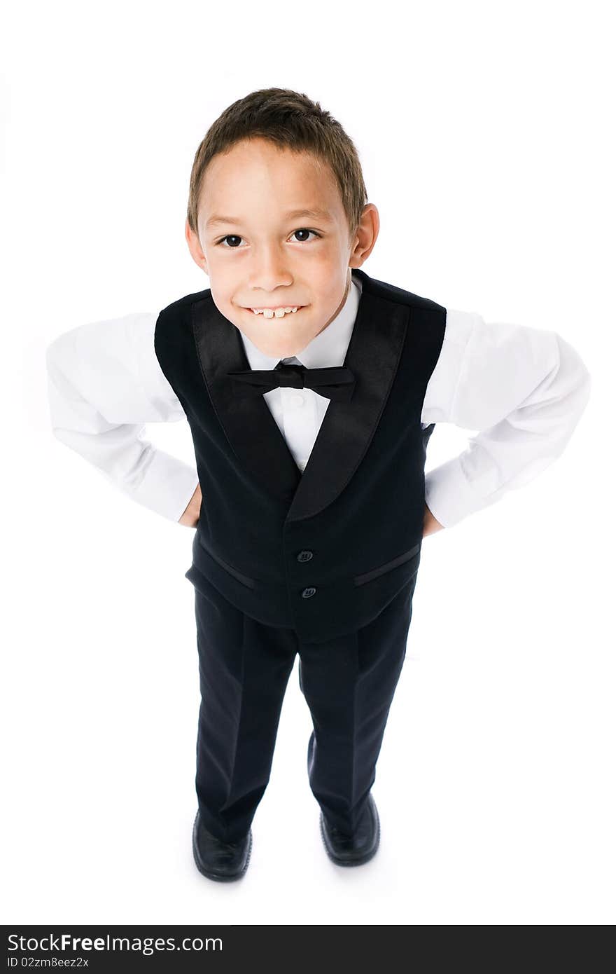 Young boy holding hands on his sides isolated on white. Young boy holding hands on his sides isolated on white