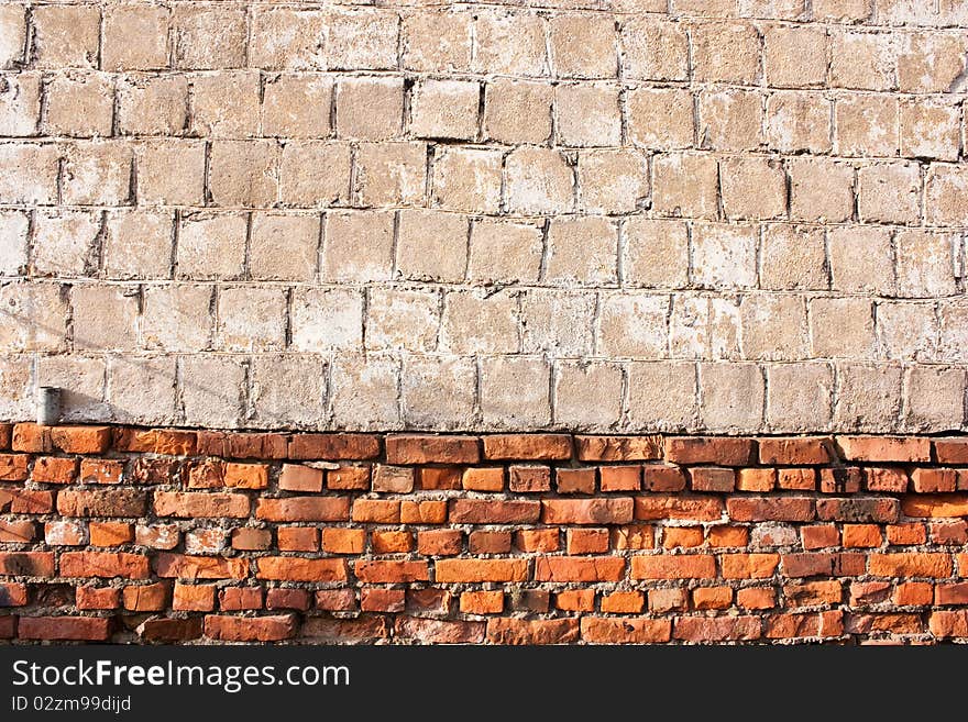 Red vintage brick and concrete wall background. Red vintage brick and concrete wall background