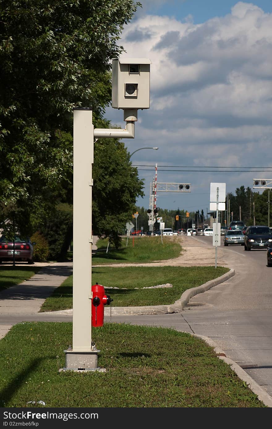 Photo radar traffic camera showing traffic and sky in background