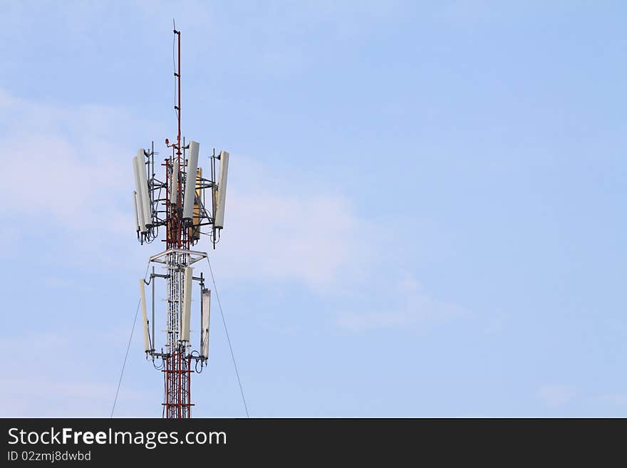 Top of a telecommunication tower with blue sky